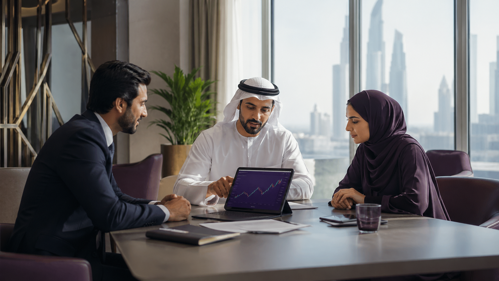 UAE finance professionals reviewing reports together in a modern office
